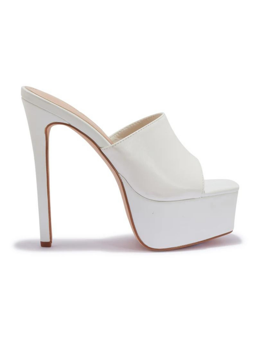 White heeled mules that have a thick platform base and stiletto shoes. The side of the shoe can be seen. 