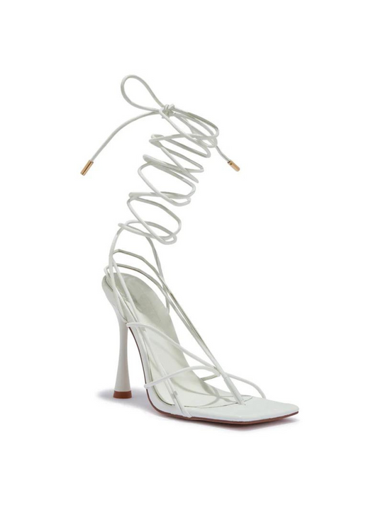 Ghost manequin wears a white strappy heeled shoes with a front square toe. The stiletto shoe has a tie up strappy fastening.