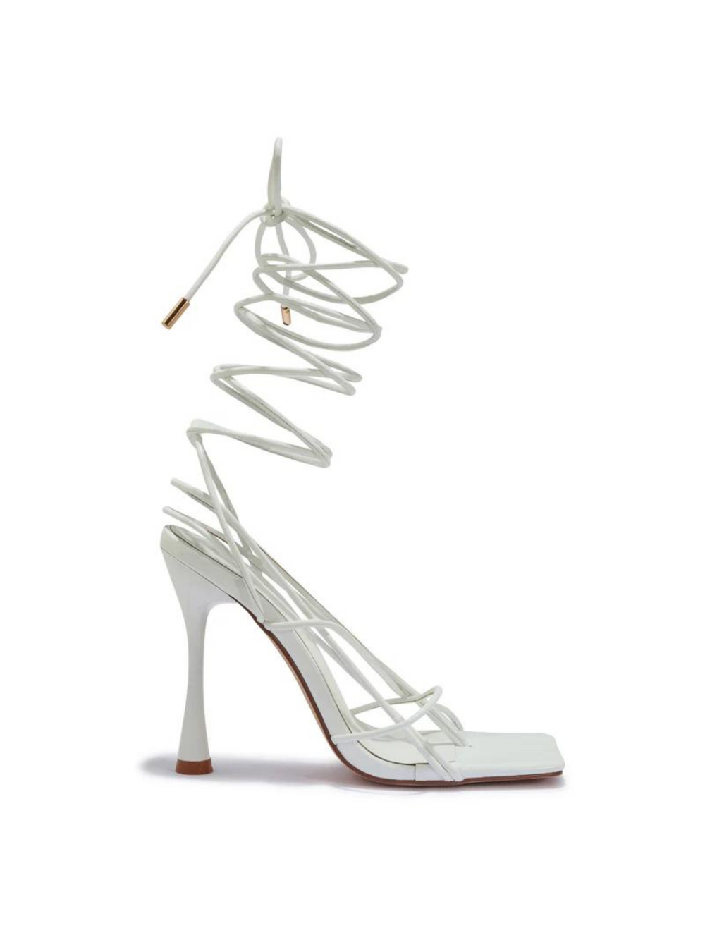 Ghost manequin wears a white strappy heeled shoes with a front square toe.  The side of the shoe can be seen, including the strappy fastening with the gold bar ends.