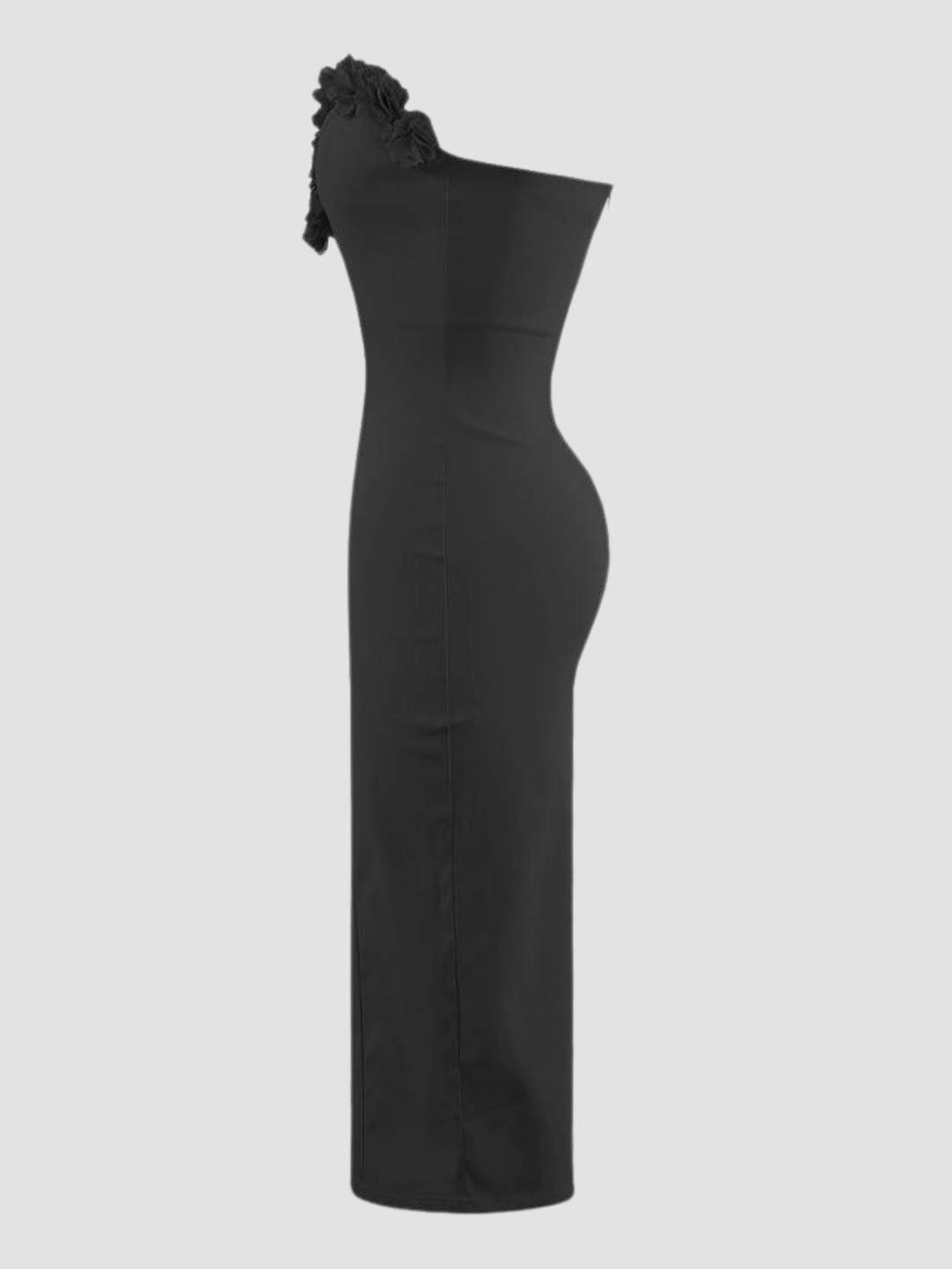 Ghost mannequin stands in front of plain background. The ghost mannequin wears a black sleeveless bodycon dress,  with a deep V-neckline and 3D rose ruffled trim. The black midi dress has a tailored bodycon silhouette fit. The ghost mannequin stands to the side, the side of the black  midi dress can be seen, including the side of the 3D rose trim sweetheart neckline design.