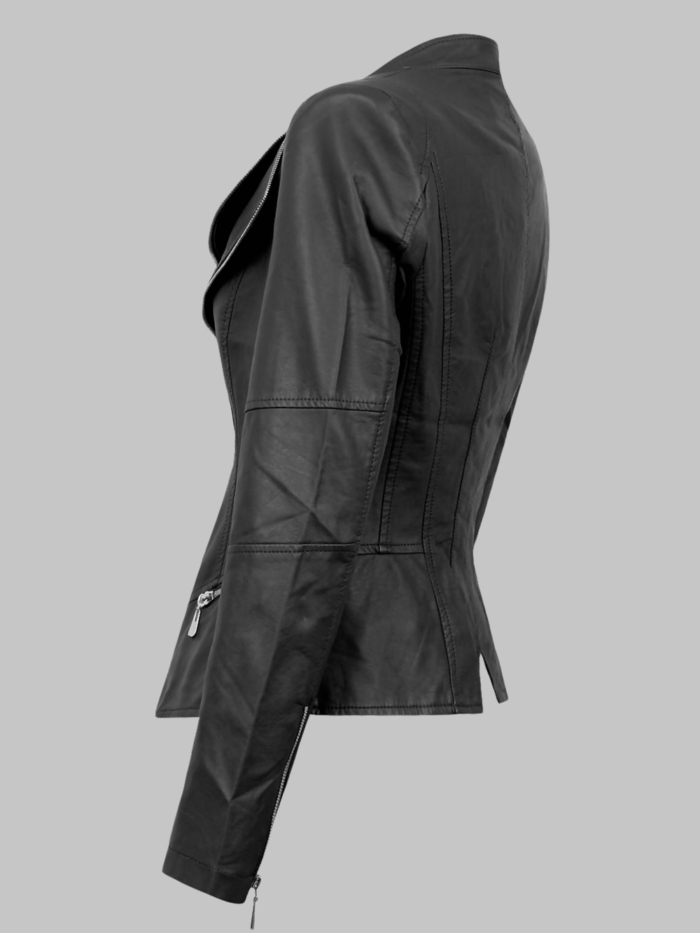 Ghost mannequin stands in front of plain background. The ghost mannequin wears a black pu leather jacket with front silver zip fastening, and a double collar with silver exposed zip design.  The ghost mannequin stands to the side, the side of the jacket can be seen, showing the faux leather panels and exposed silver zip side. 