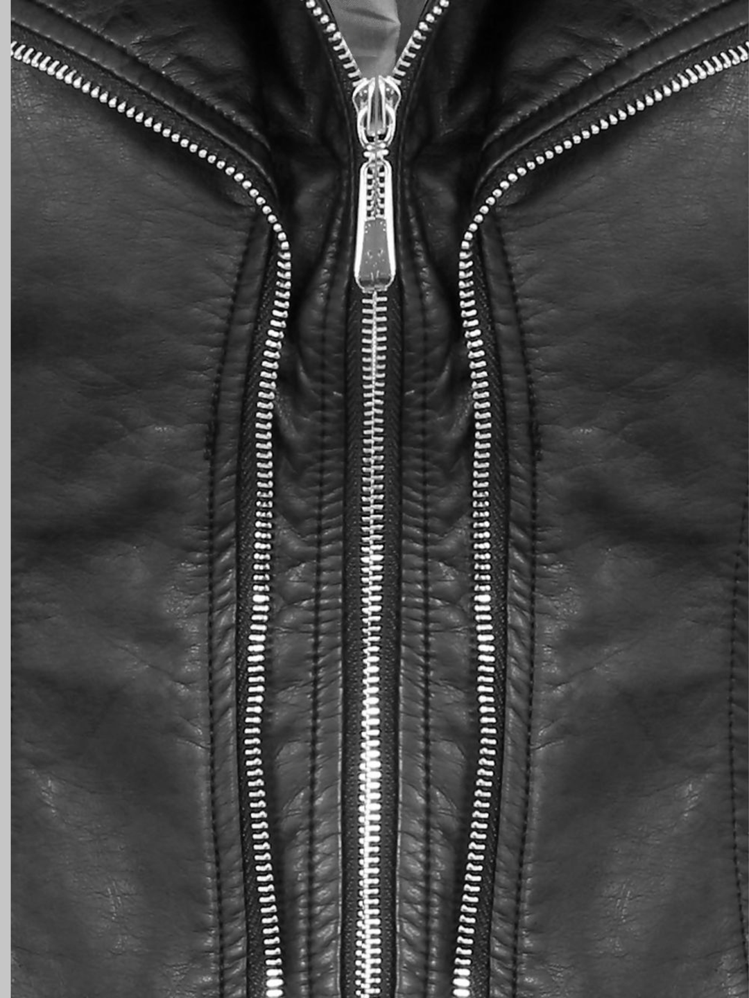 Close up of faux leather jacket, the exposed silver zip fastening can be seen, as well the double zip design.