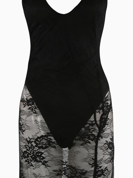 Close up. The ghost mannequin wears a sheer black lace maxi dress, with black bodysuit insert, v neckline and spaghetti straps