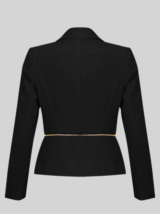 Ghost mannequin stands in front of the black blazer,  with single  front button fastening and exposed side zip design and long sleeves. The ghost mannequin stands with its back to the camera, the back of the  fitted luxe blazer, the gold exposed zip can be seen across the waist.