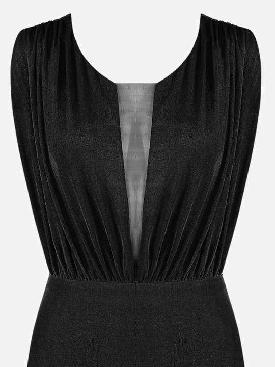 Close up. Ghost mannequin stands in front of a plain background, she wears a black mini dreess with a round neckline,  a front sheer panel  and a sleevless design. The top of the ress can be seen, including the sheer panel front. 
