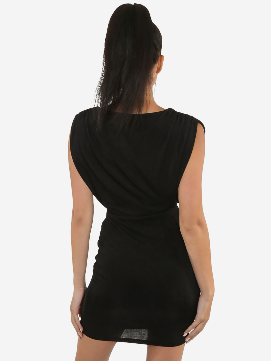 Model stands in front of a plain background, she wears a black mini dreess with a round neckline,  a front sheer panel  and a sleevless design.The model has tanned skin and long grown hair which is styled in a ponytail, she stands with her back to the camera, placing her hands by her sides. 