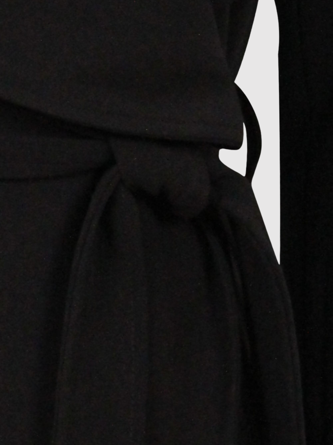 Close up of the belt on a black wrap coat.