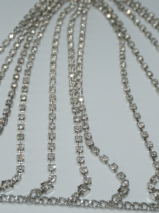 Close up of diamante links of the silver diamante bralette. 