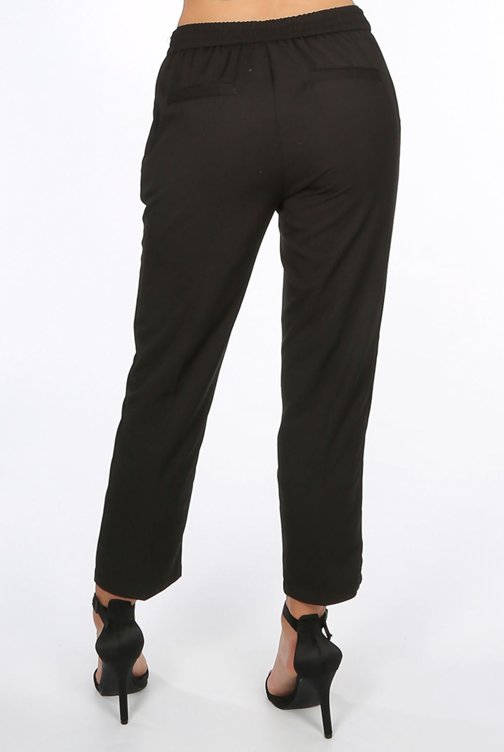 4ever Stunning black trousers. This womens trousers boasts a 3/4 leg and side zip. The back pockets have two pockets on either side.