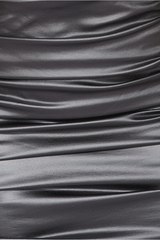 Close up of the ruched black faux leather material.