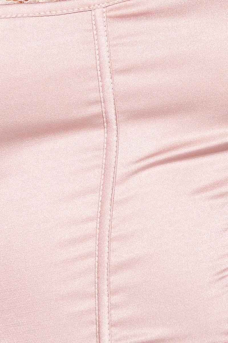 Close up of the satin pink top.