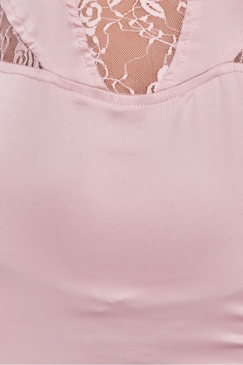 Close up of pink lace detailing and satin dress.