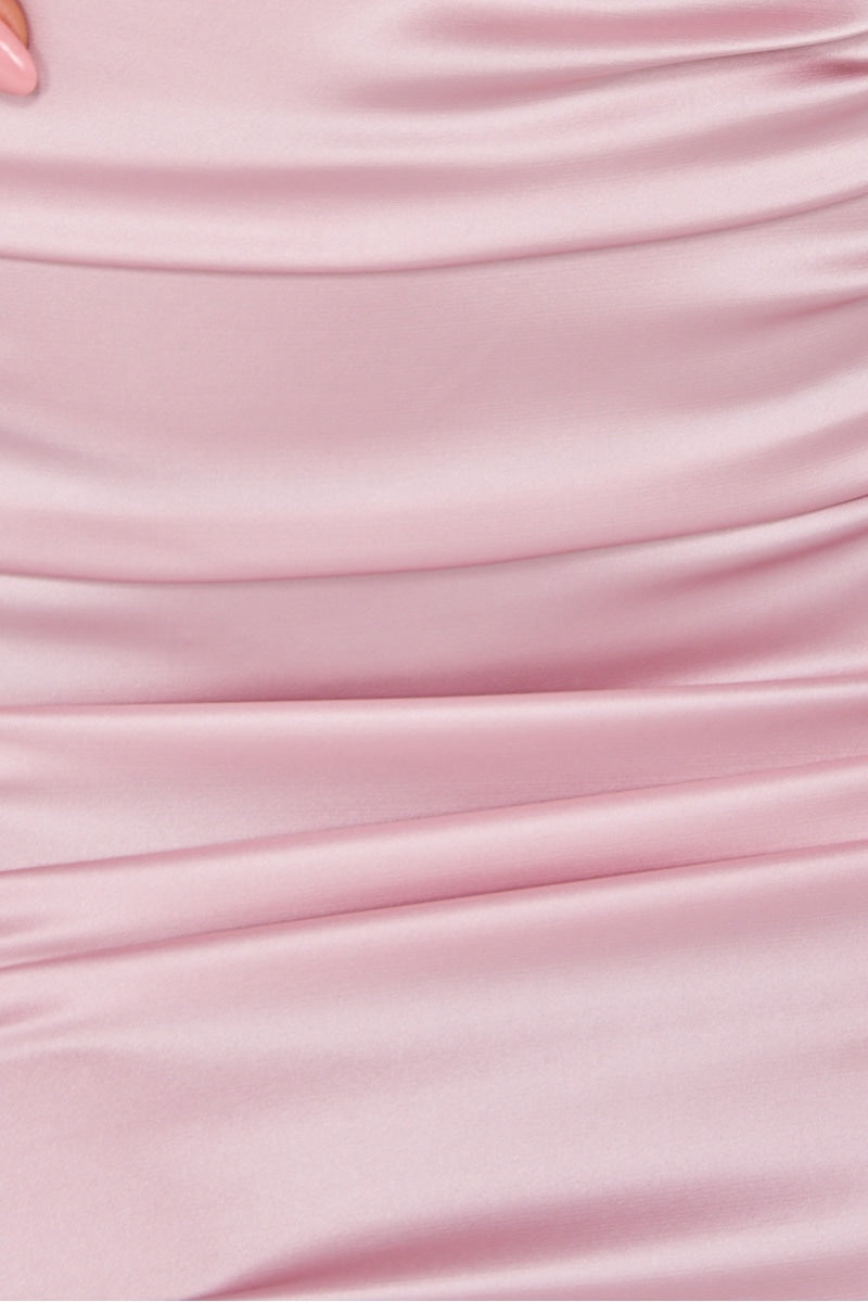 close up of pink ruched satin material. 