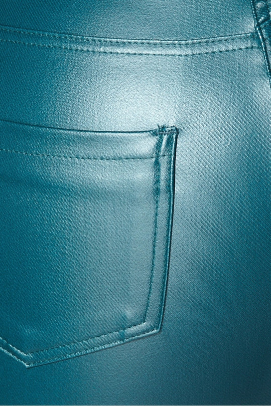 Close up of teal faux leather jeggings back pockets.